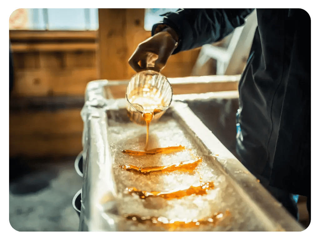 Making a maple syrup taffy at a Cabane Sucre