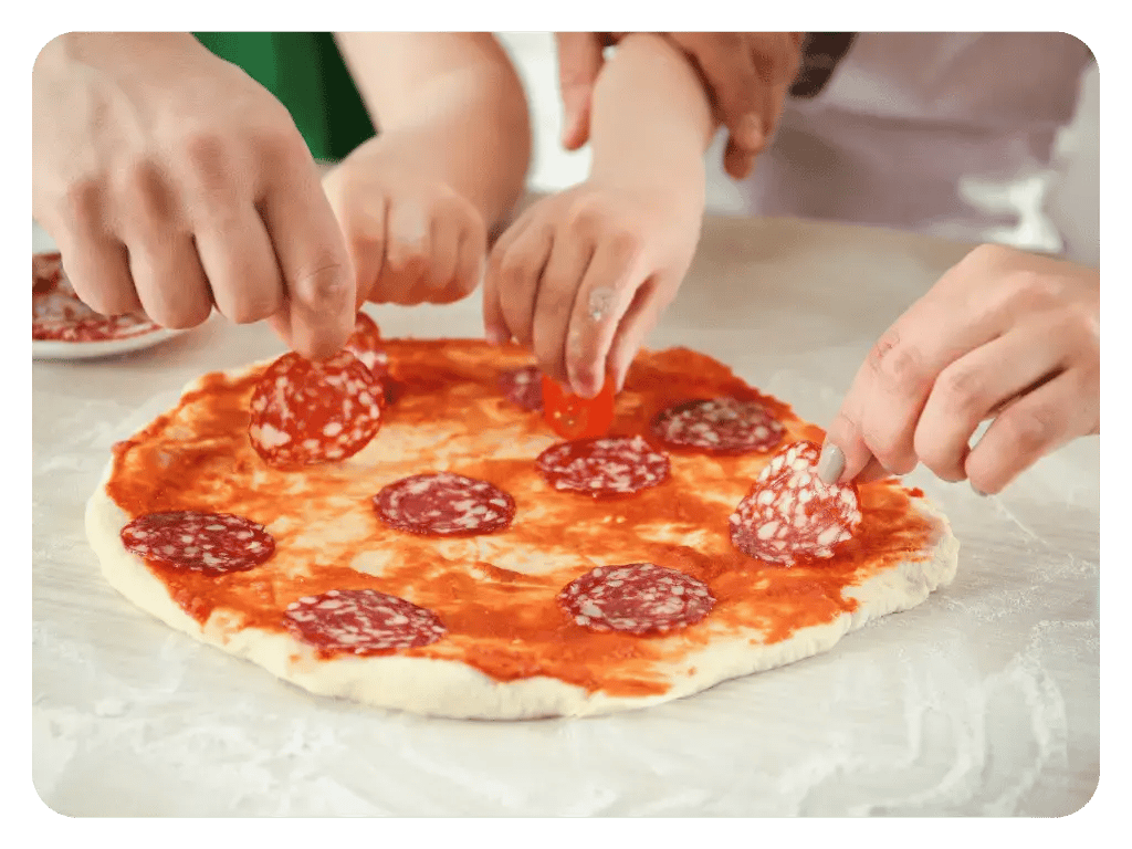 Kids enjoying a make your own pizza - Quebecois style